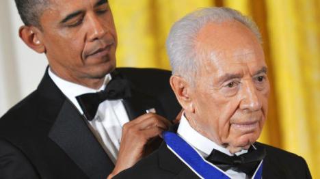 Barack Obama has awarded the Presidential Medal of Freedom to Criminal Israeli President Shimon Peres